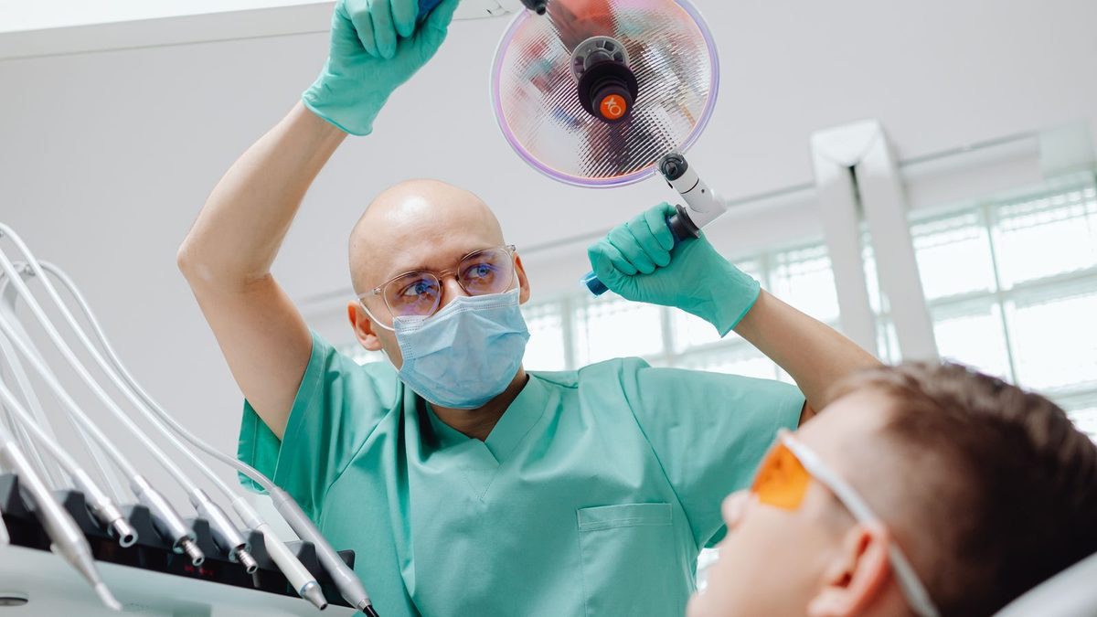 A dentist examining a patient in a modern dental clinic