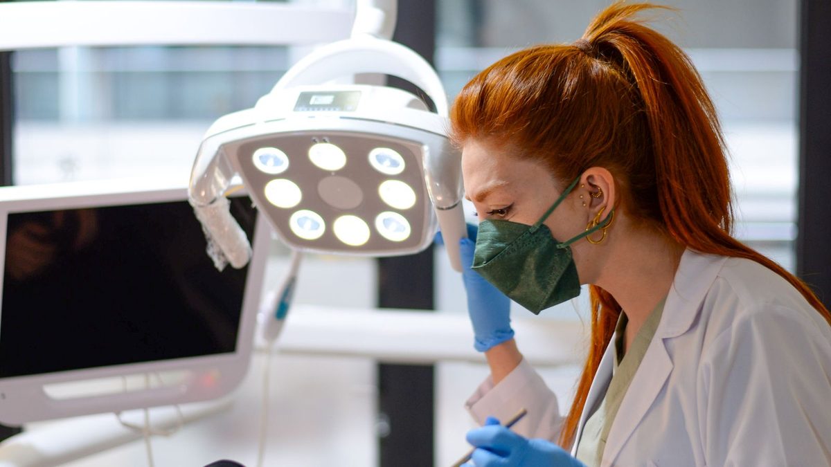 A dentist examining a patient in a modern dental clinic
