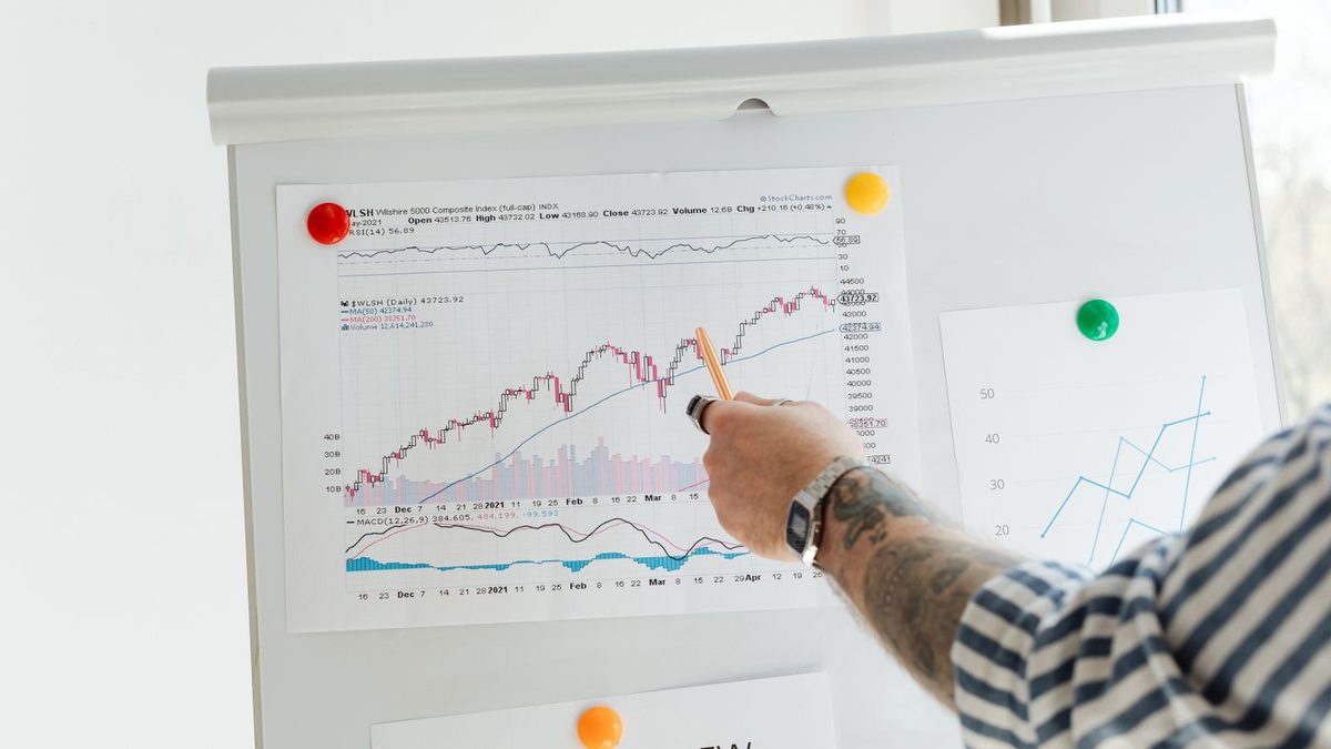 A professional analyzing health plan cost and claims data with charts