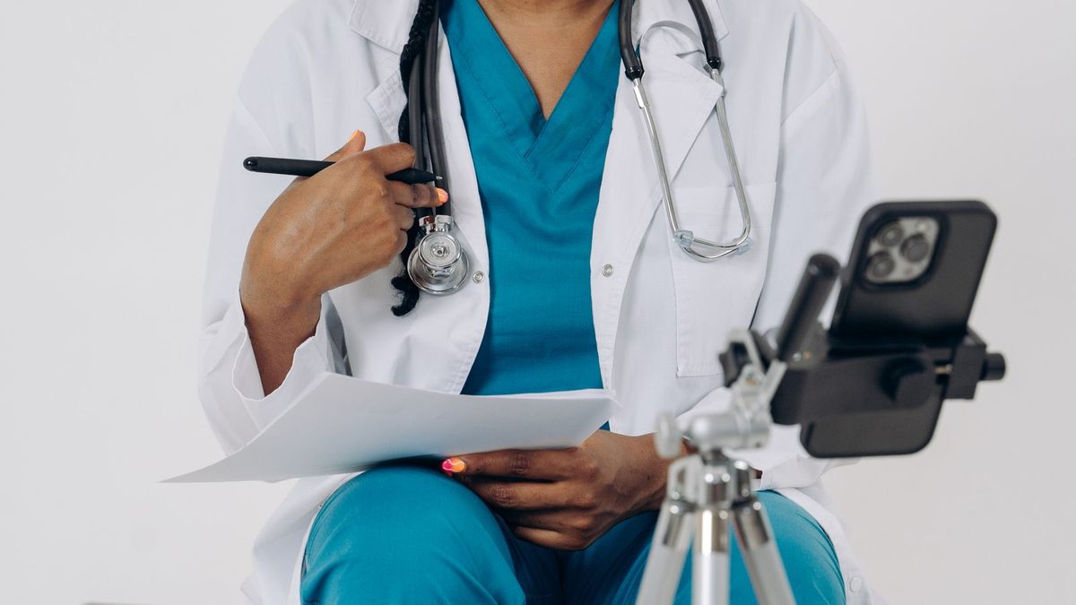 A doctor conducting a telemedicine video consultation with a patient