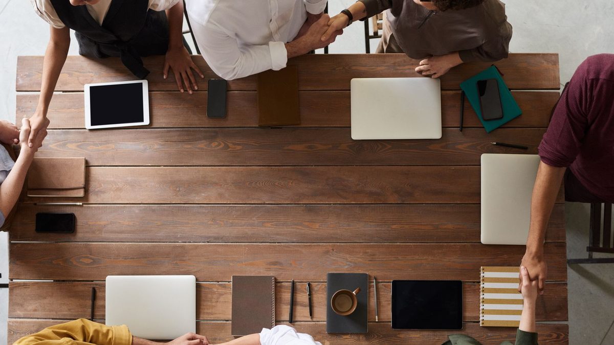 Two professionals shaking hands to finalize a business agreement
