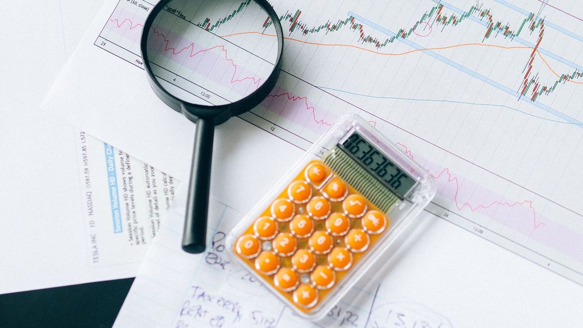 A professional analyzing health plan cost and claims data with charts