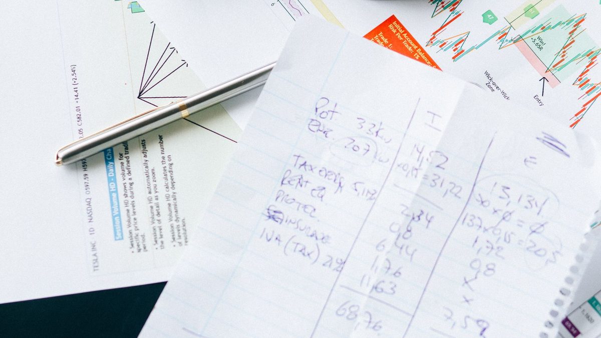 A professional analyzing health plan cost and claims data with charts
