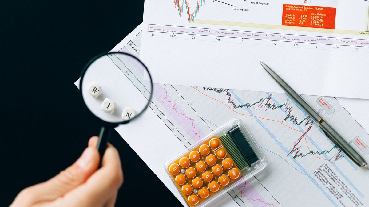 A professional analyzing health plan cost and claims data with charts
