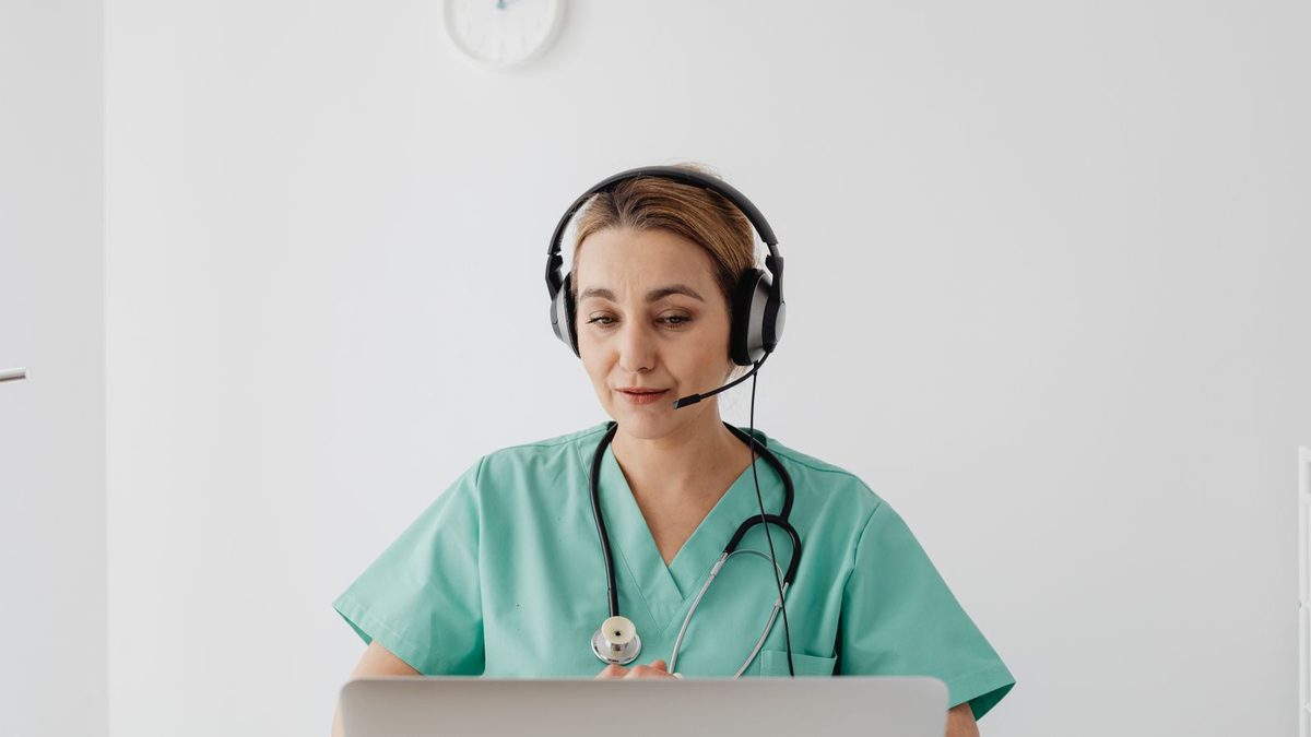 A diverse team of professionals discussing employee health benefits in a modern office