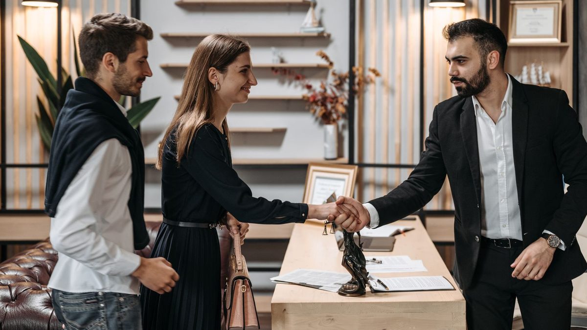 A diverse team of professionals discussing employee health benefits in a modern office