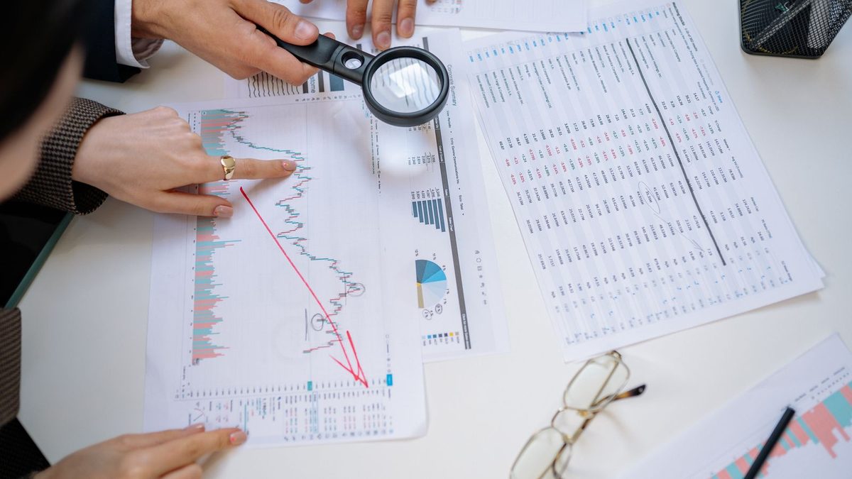 A diverse team of professionals discussing employee health benefits in a modern office