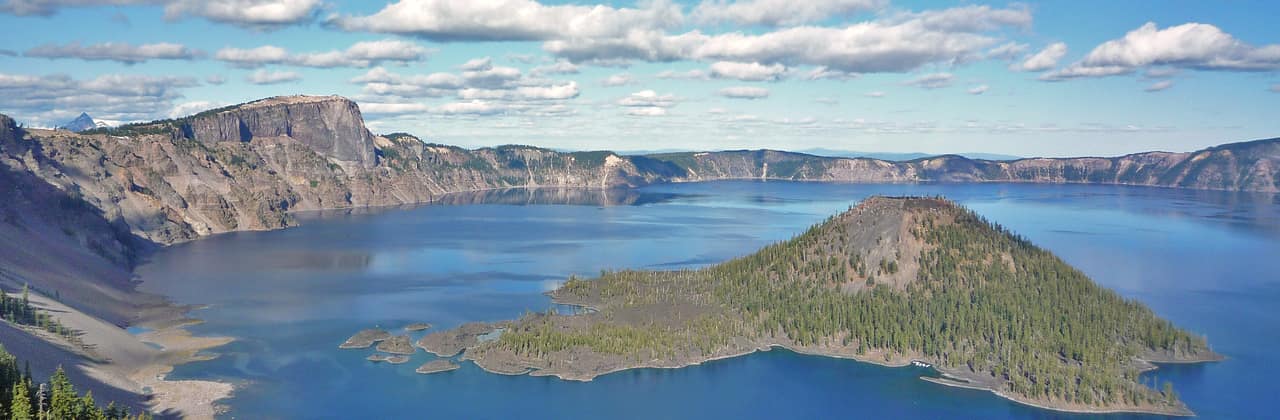 Deep blue Crater Lake in Oregon with Wizard Island, seen from the west rim