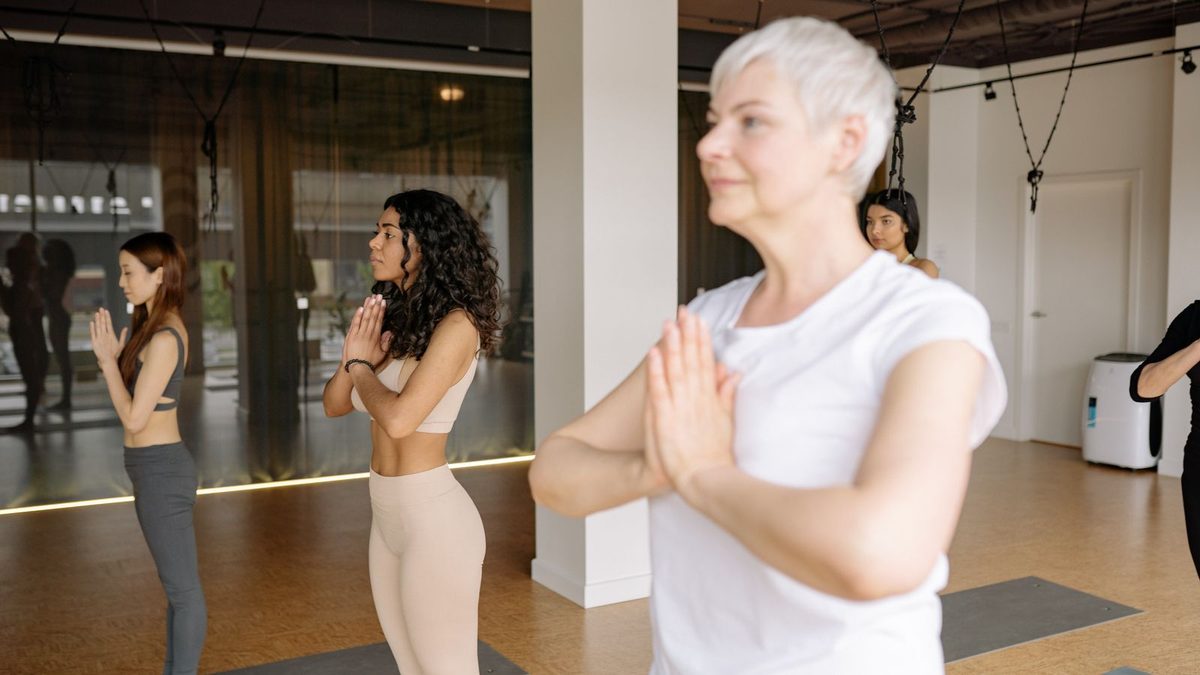 An employee practicing wellness and mindfulness in a bright office