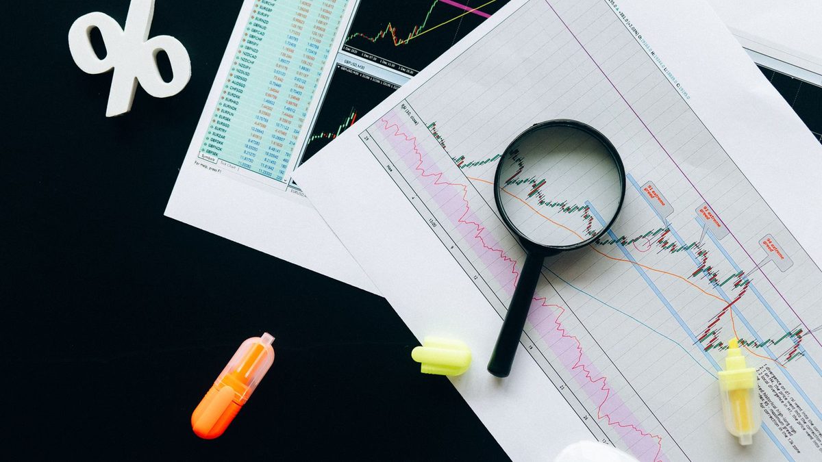A professional analyzing health plan cost and claims data with charts