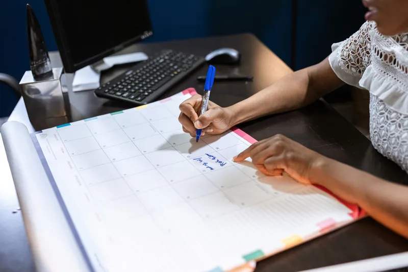 Employer marking the December 15 small group enrollment deadline on a desk calendar