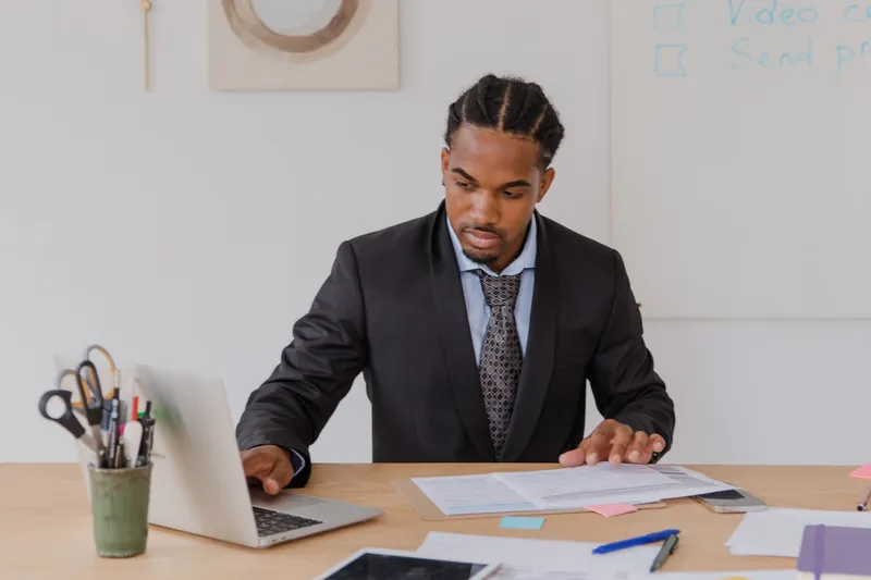 Small business owner comparing a small group special enrollment period quote with PEO and level funded options