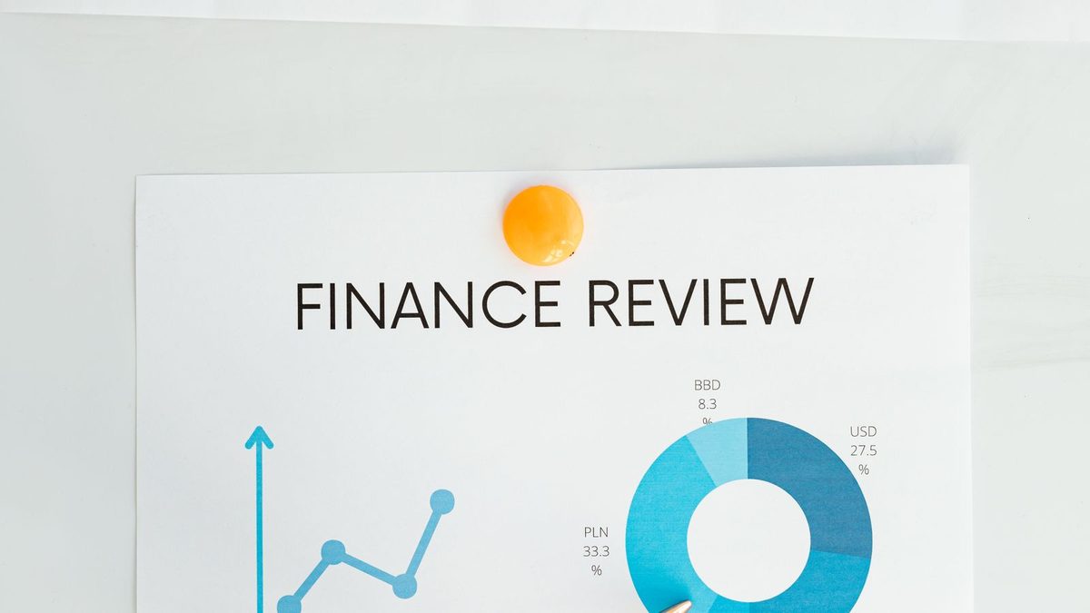 A professional analyzing health plan cost and claims data with charts