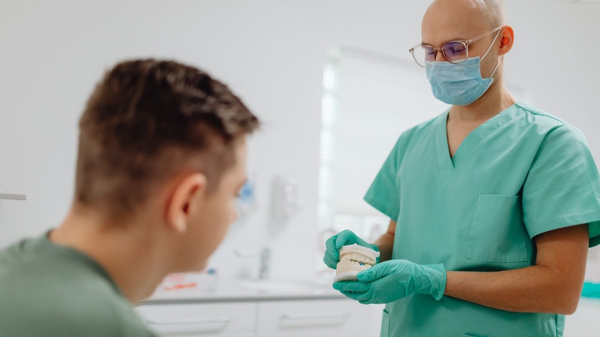 A diverse team of professionals discussing employee health benefits in a modern office