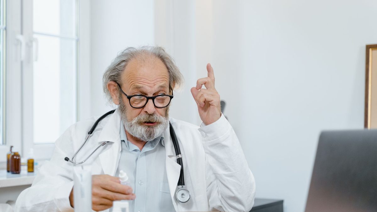 A doctor conducting a telemedicine video consultation with a patient